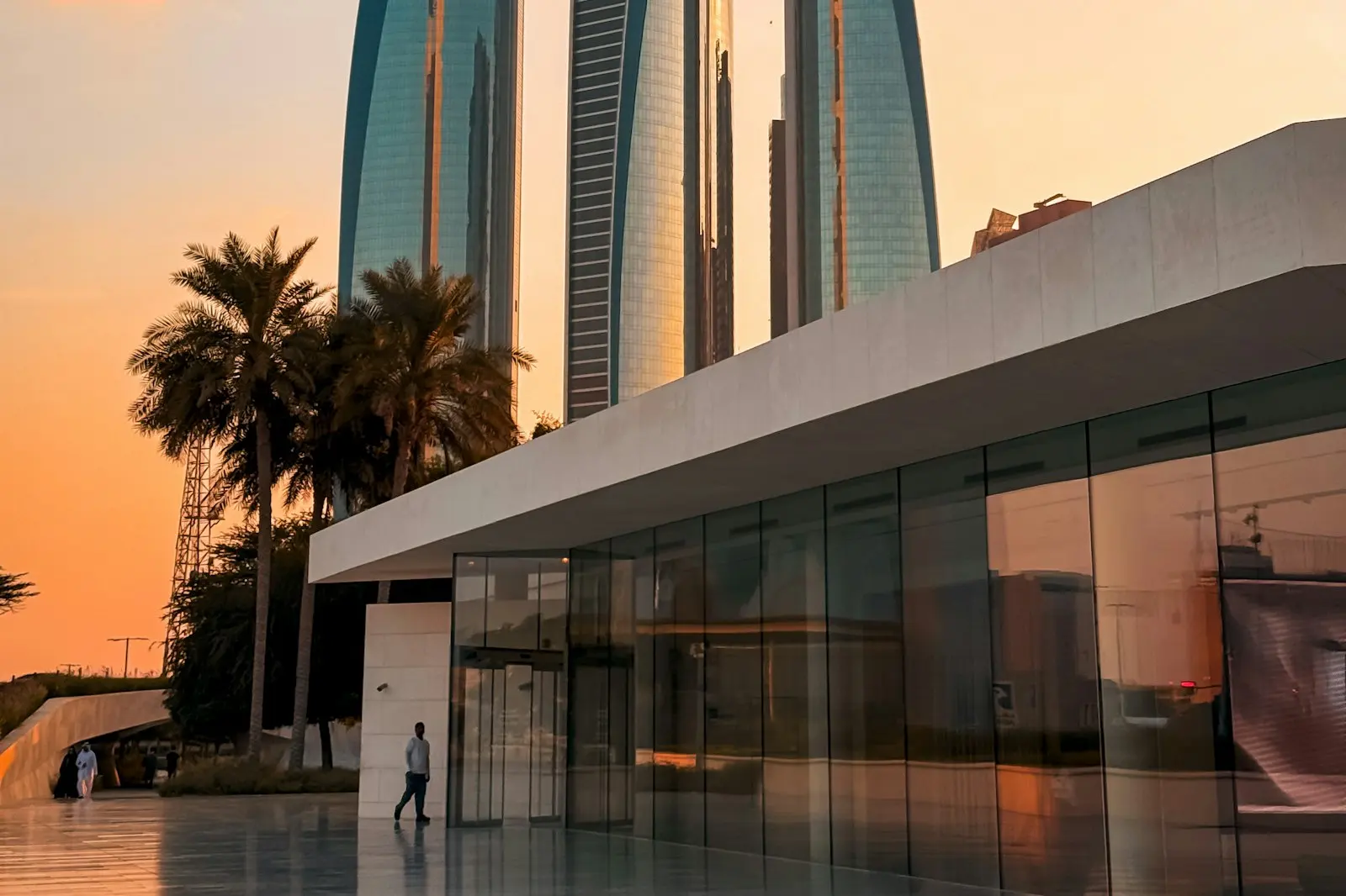 Glass office towers in Abu Dhabi at sunset
