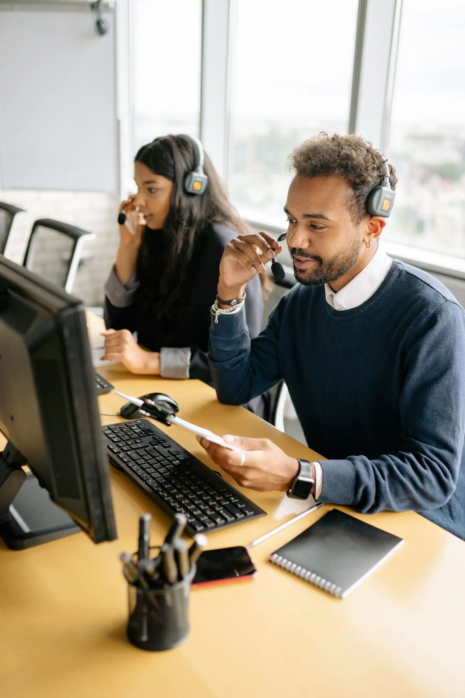 Support team working alongside AI automation tools in a UAE office