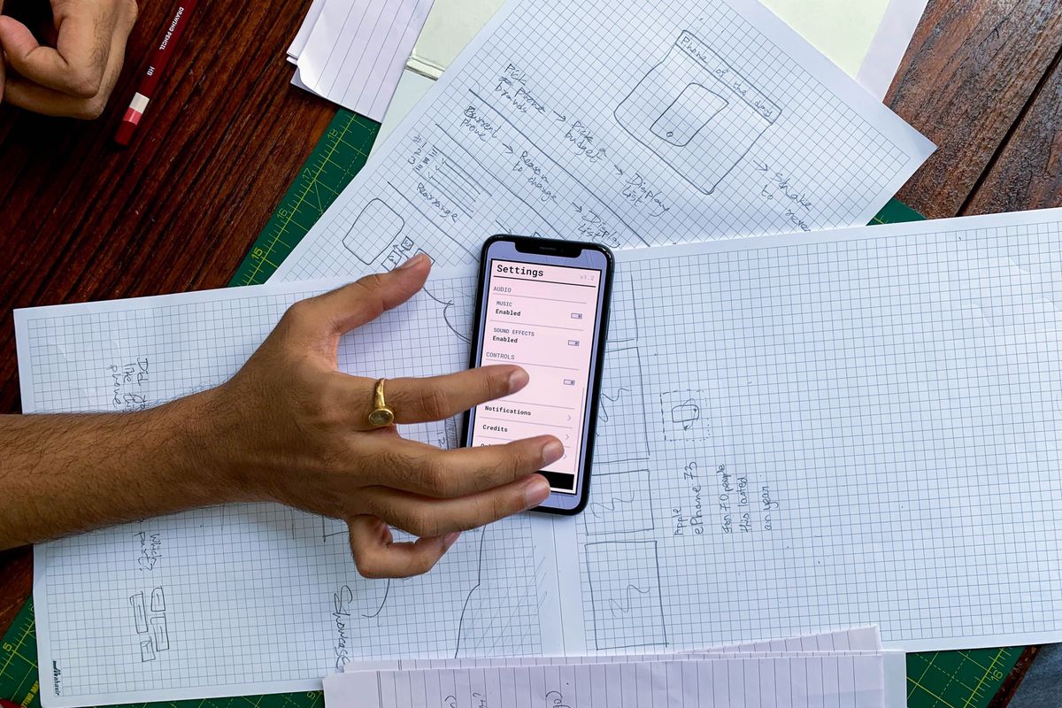 Planning a mobile app with interface sketches before development begins