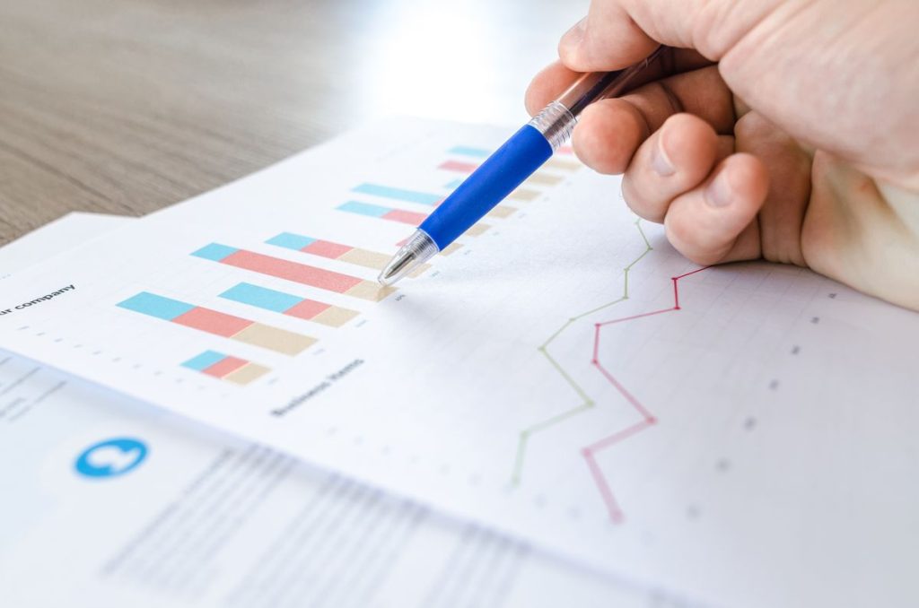Analyst reviewing on-page SEO performance charts and rankings